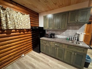 Fridge, microwave, coffee/tea maker, cookware/dishes/utensils