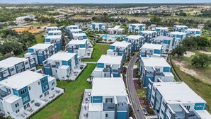 A modern residential complex with multiple two-story buildings, arranged in a grid pattern.