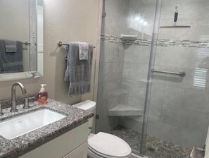 Shower, hair dryer, towels, soap