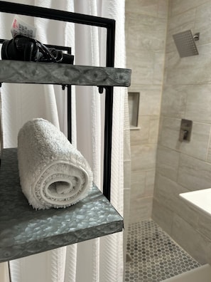 Shower, hair dryer, towels, soap