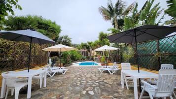Outdoor pool, open 9:00 AM to 10:00 PM, pool umbrellas, sun loungers