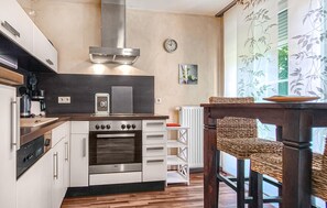 Fridge, stovetop, dishwasher, coffee/tea maker