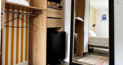 Bedroom with bathroom and garden in Maison Meulière