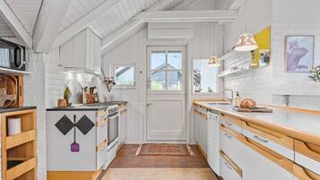 Fridge, stovetop, dishwasher, coffee/tea maker