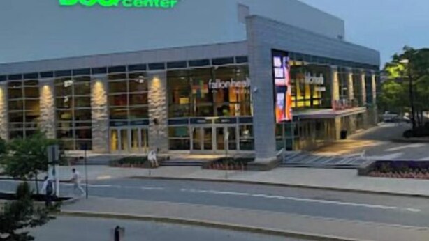 A modern building with a sign reading "DCU Center". - Bright Charming/Netflix/Roku

 (Worcester)