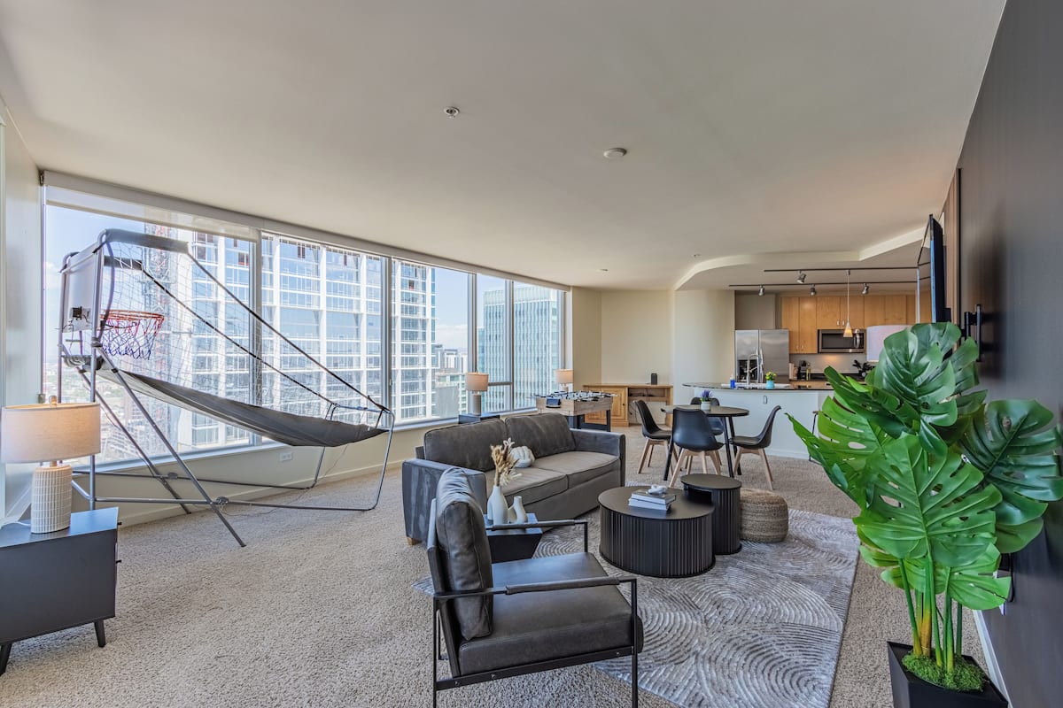 Deluxe Apartment, 2 Bedrooms, Refrigerator & Microwave | Living area | 55-inch Smart TV with digital channels