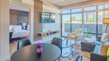 Comfort Apartment, 1 Bedroom, Kitchen | Living area | 55-inch Smart TV with digital channels