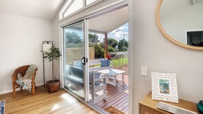 Relax in this serene room with a sliding glass door leading to a patio area.