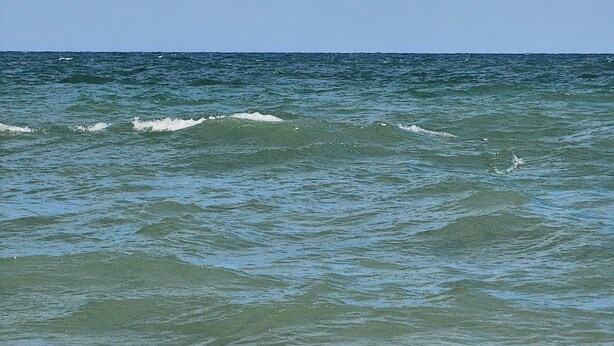 A view of the ocean with waves approaching the shore. - Spacious Beach House Steps to Sand in delightful Ocean Isle Beach NC (Ocean Isle Beach)