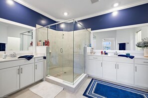 Shower, hair dryer, towels, toilet paper