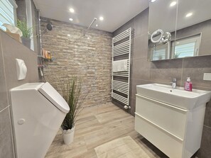 Shower, hair dryer, towels, soap