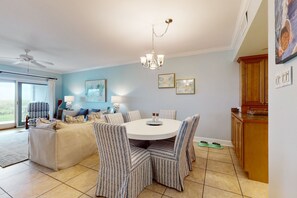 Enjoy meals in this stylish dining area with a round table and comfortable seating for all.