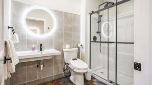 A bathroom with a toilet, sink, and glass shower enclosure. - *New* Loft 7 min to Acrisure Stadium Sleeps 4 (Pittsburgh)