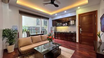 Luxury Apartment, City View | Living area | TV