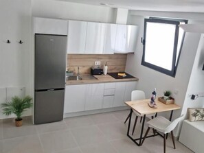 Fridge, microwave, coffee/tea maker, toaster