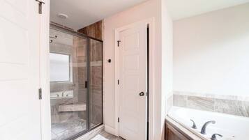 Shower, hair dryer, towels, shampoo