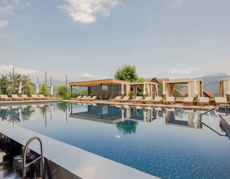 Outdoor pool, open 9:00 AM to 9:00 PM, pool umbrellas, sun loungers