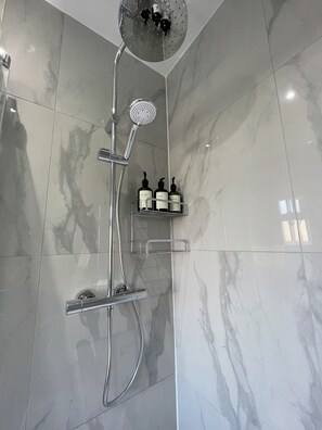 Shower, hair dryer, towels, soap