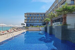 Outdoor pool, open 7:00 AM to 8:00 PM, pool umbrellas, pool loungers