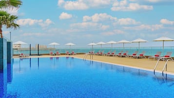 Outdoor pool, open 7:00 AM to 8:00 PM, pool umbrellas, pool loungers