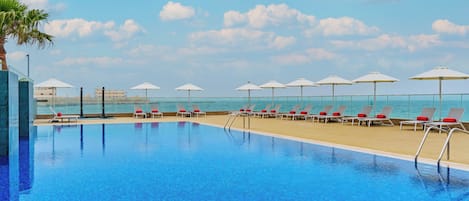 Outdoor pool, open 7:00 AM to 8:00 PM, pool umbrellas, pool loungers