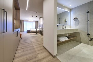 Glemm Suite | Hypo-allergenic bedding, in-room safe, laptop workspace, blackout drapes