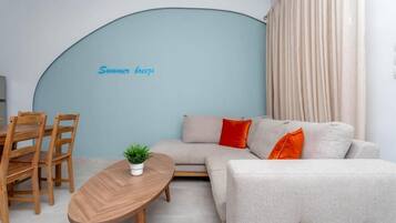 Premium Apartment | Living area | Flat-screen TV