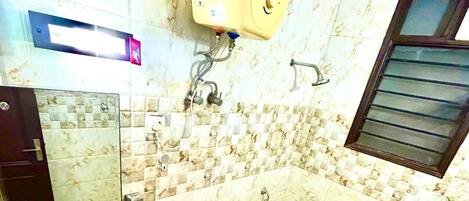 A bathroom with a sink, toilet, and shower.