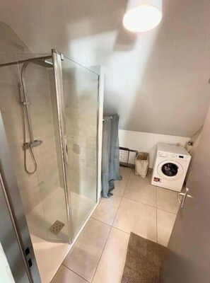 Shower, hair dryer, towels, soap