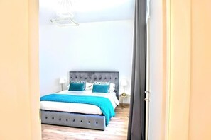 1 bedroom, desk, iron/ironing board, travel crib