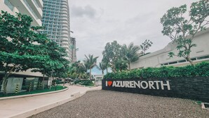 A modern building with a sign reading "AZURENORTH". - Luxury Penthouse in CBD w/ Wave Pool, 7ft Billiards & Wide Balcony for Getaways (San Fernando)