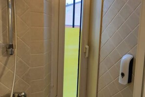 Shower, eco-friendly toiletries, hair dryer, bidet
