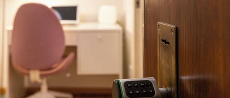 A door with a biometric fingerprint scanner.