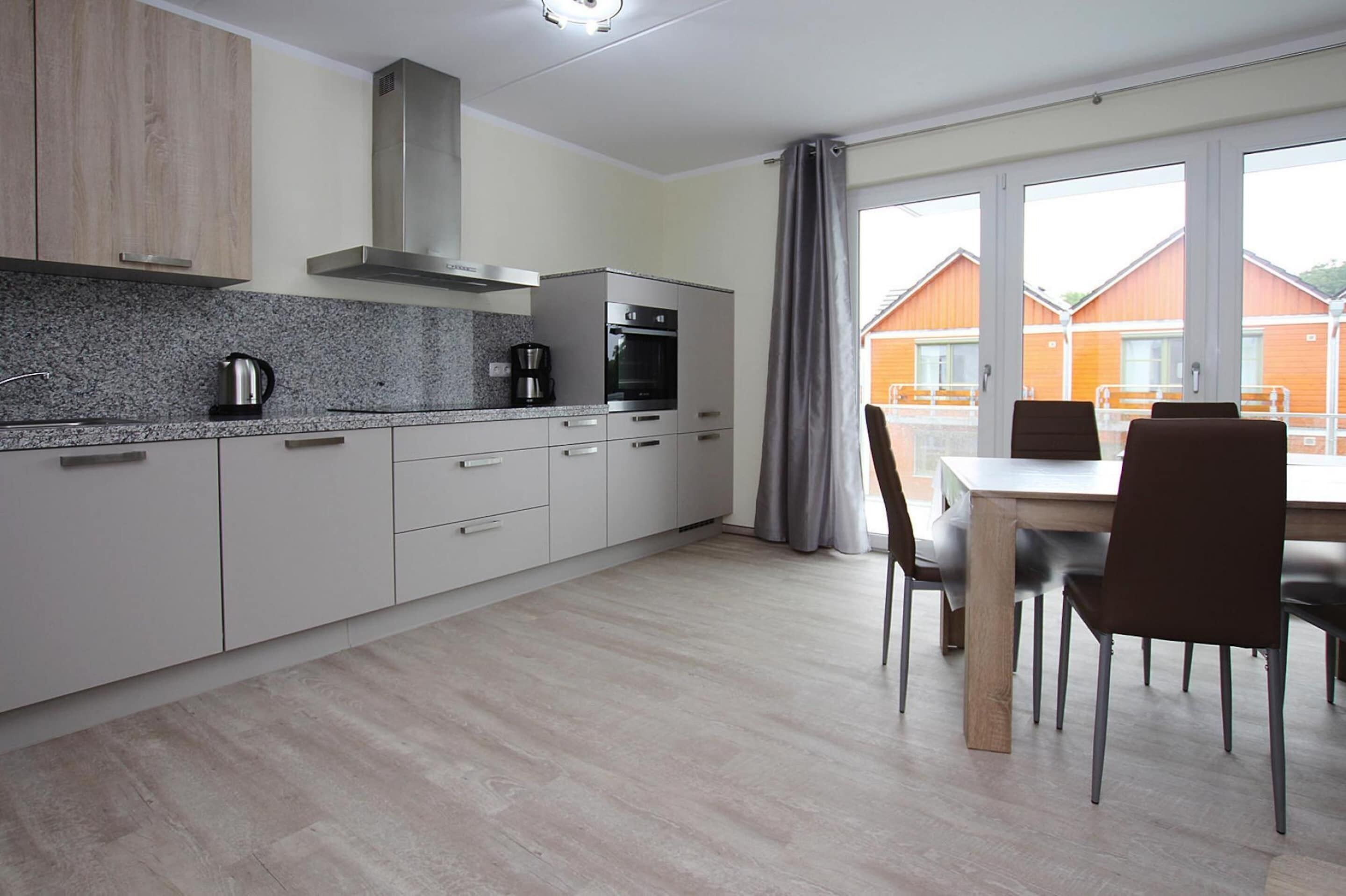 Elite Apartment, 4 Bedrooms | Private kitchen | Fridge, oven, dishwasher, coffee/tea maker