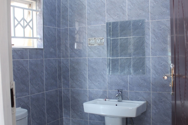 Shower, towels, soap, toilet paper