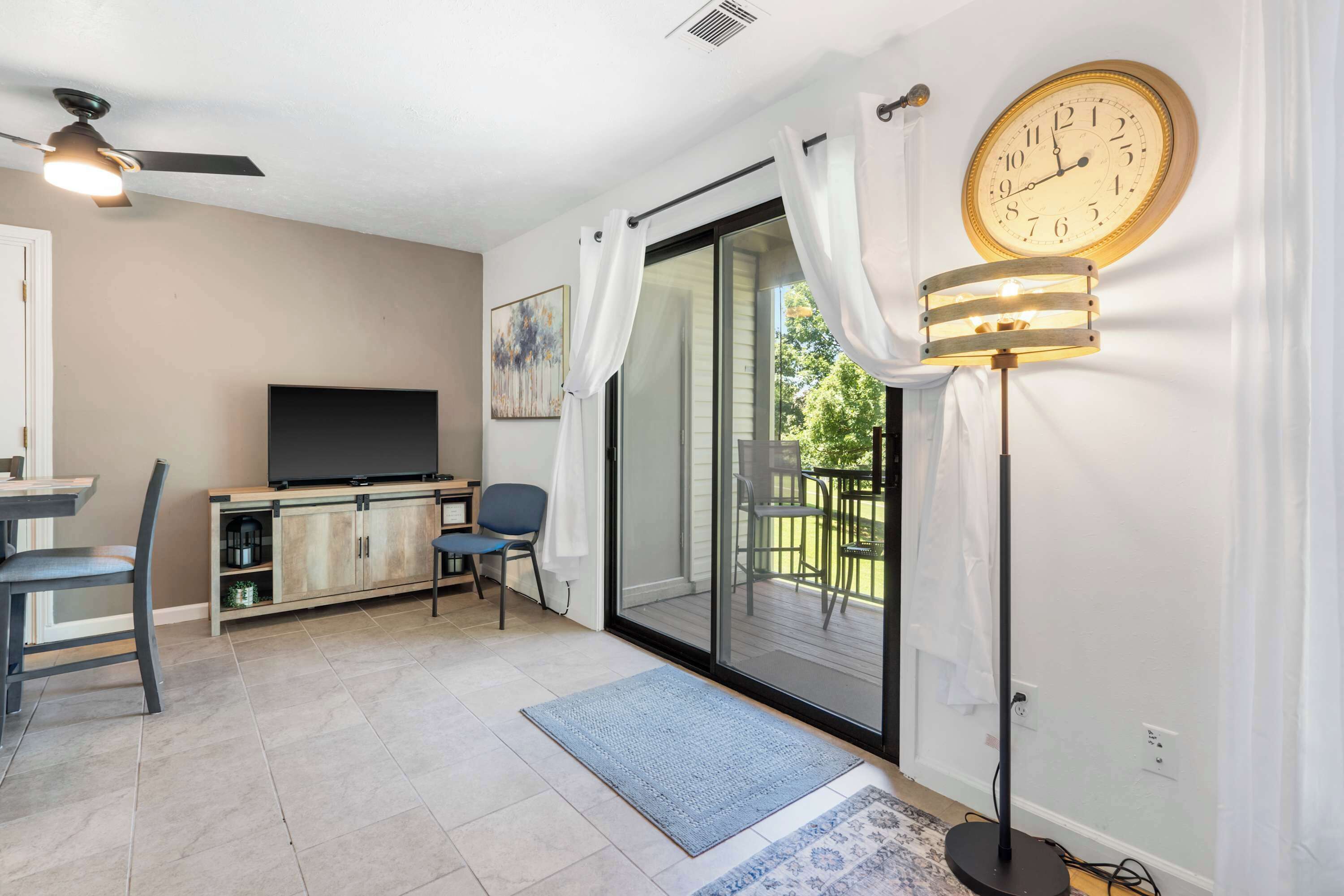 Bright living space with comfy seating and Smart TV