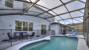 An indoor swimming pool with a glass ceiling, a hot tub, and a seating area with chairs and a table. - World Showcase At Windwood Bay By Shine Villas 5 Bedroom Villa (Davenport)