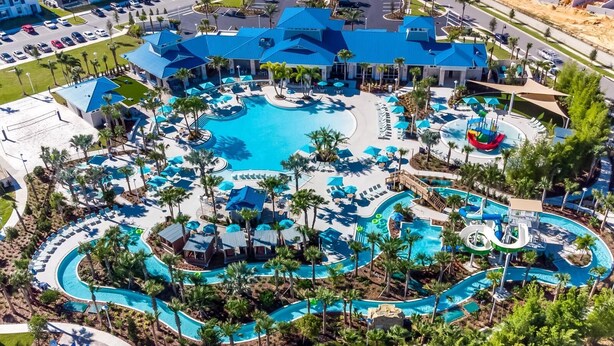 A resort with a large central pool, multiple smaller pools, and a water park area. - West Facing Pool & Spa, Games Room, 8 Bedrooms. Sleeps 18 in comfort and fun! (Davenport)