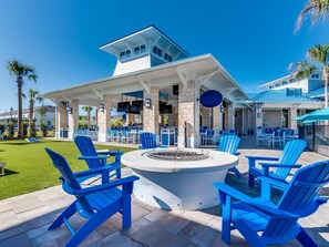 Relax in style with Adirondack chairs and picnic tables surrounding a cozy fire pit.