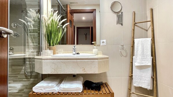 Shower, hair dryer, towels, soap
