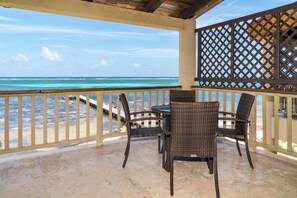 Outdoor dining - 2 BR Oceanfront Condo with Barrier Reef Views, Resort Pools, Sleeps 5 (San Pedro Town)