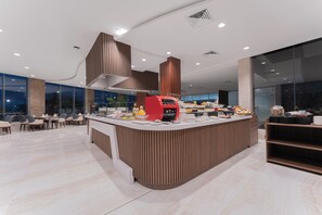 Enjoy a meal or snack at our central counter, surrounded by a variety of food options and comfortable seating.