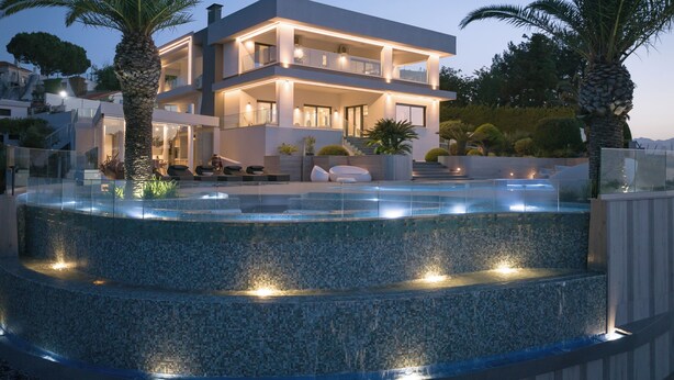 A modern two-story house with a pool, outdoor seating, and palm trees. - Villa Kalliston - 4000m2 of Elevated Living (Rethymno)