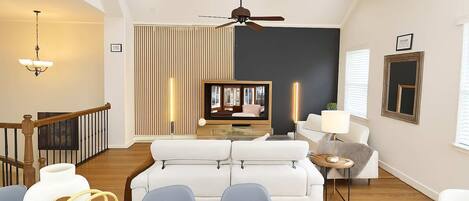 A modern living room with a sofa set, a dining table, and a TV.