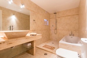 A modern bathroom with a large mirror, a sink, a shower, and a bathtub. - Villa Cristallo - Ten Bedroom Villa, Sleeps 20 (Praia da Luz)