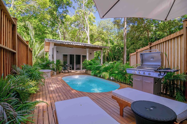 Discover a serene beach house with a private pool nestled in lush.