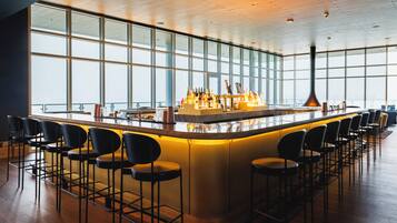 3 bars/lounges, rooftop bar, lobby lounge