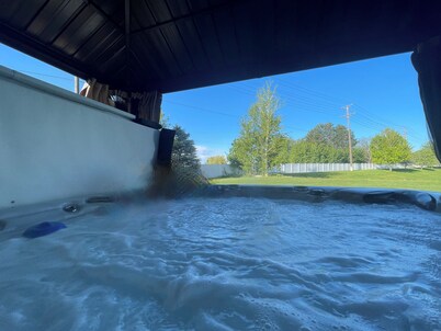 Spacious 5-bedroom house with hot tub, WiFi, and 80 inch big screen TV 