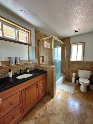 Shower, hair dryer, towels, soap