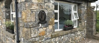 Traditional stone cottage on the river in charming Cashel, Tipperary